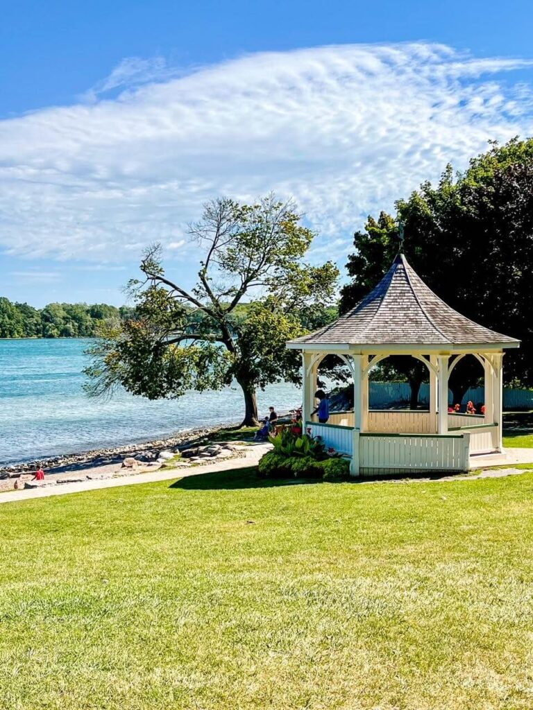 Grassy park with white gazebo along the Niagara River.