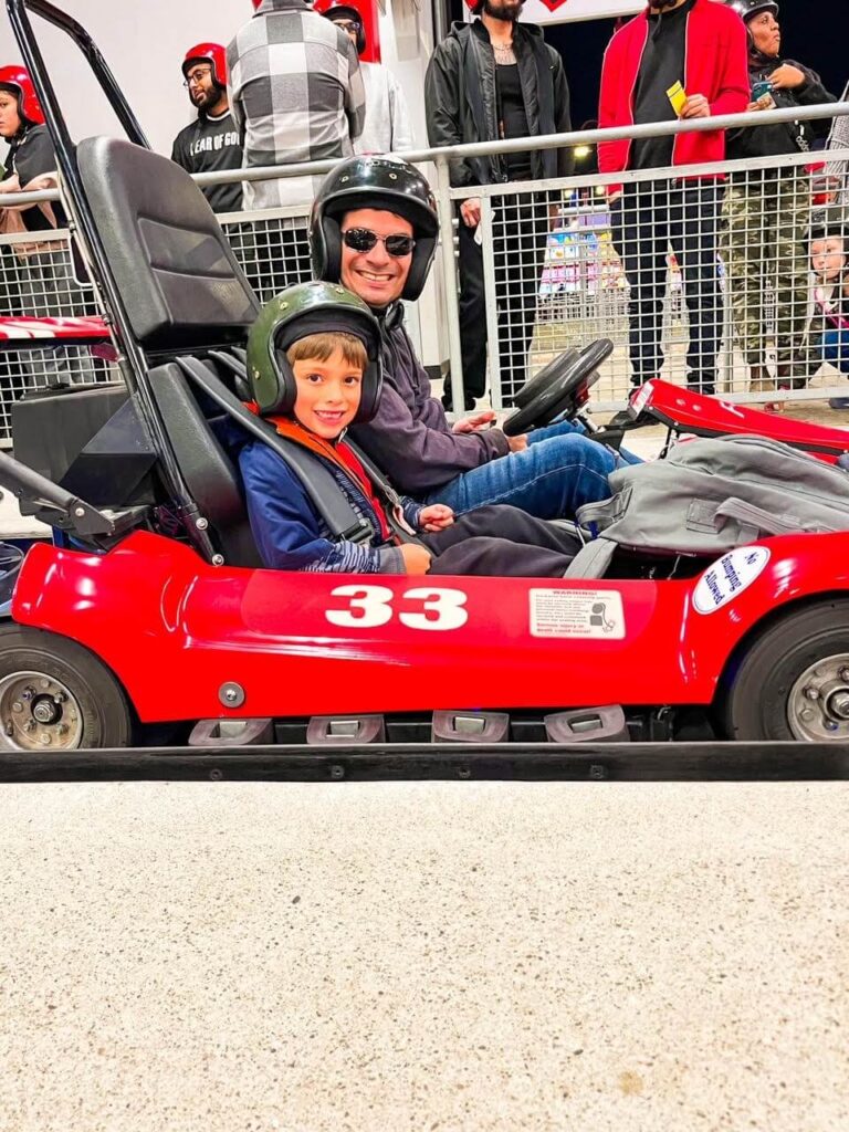Father and son in a go kart at Niagara Speedway
