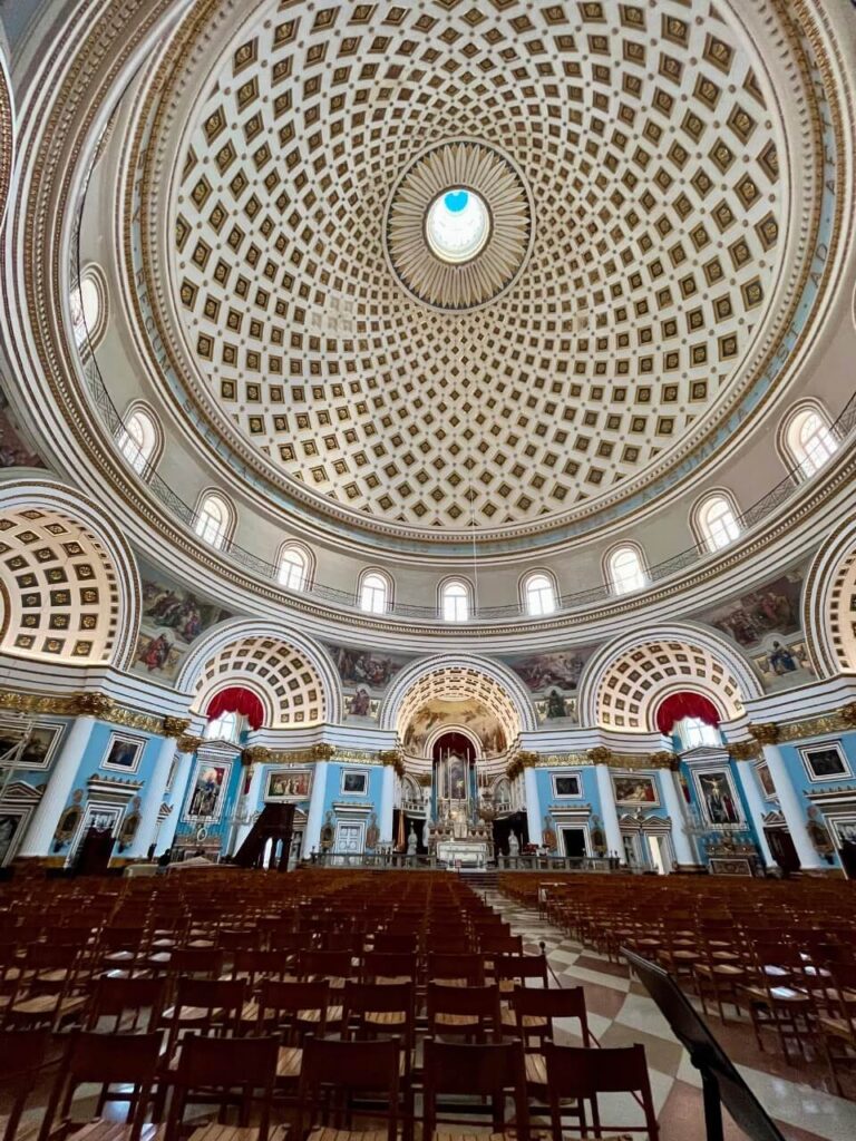 Church in Mosta, large dome roof with a window at the top where a bomb broke though during WW11. 