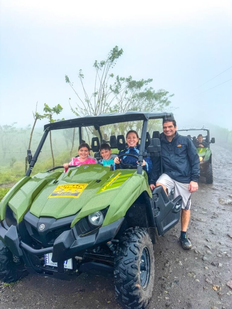 Side by Side atv with Outback Adventures in La Fortuna, with our family of 4 sitting in it. 